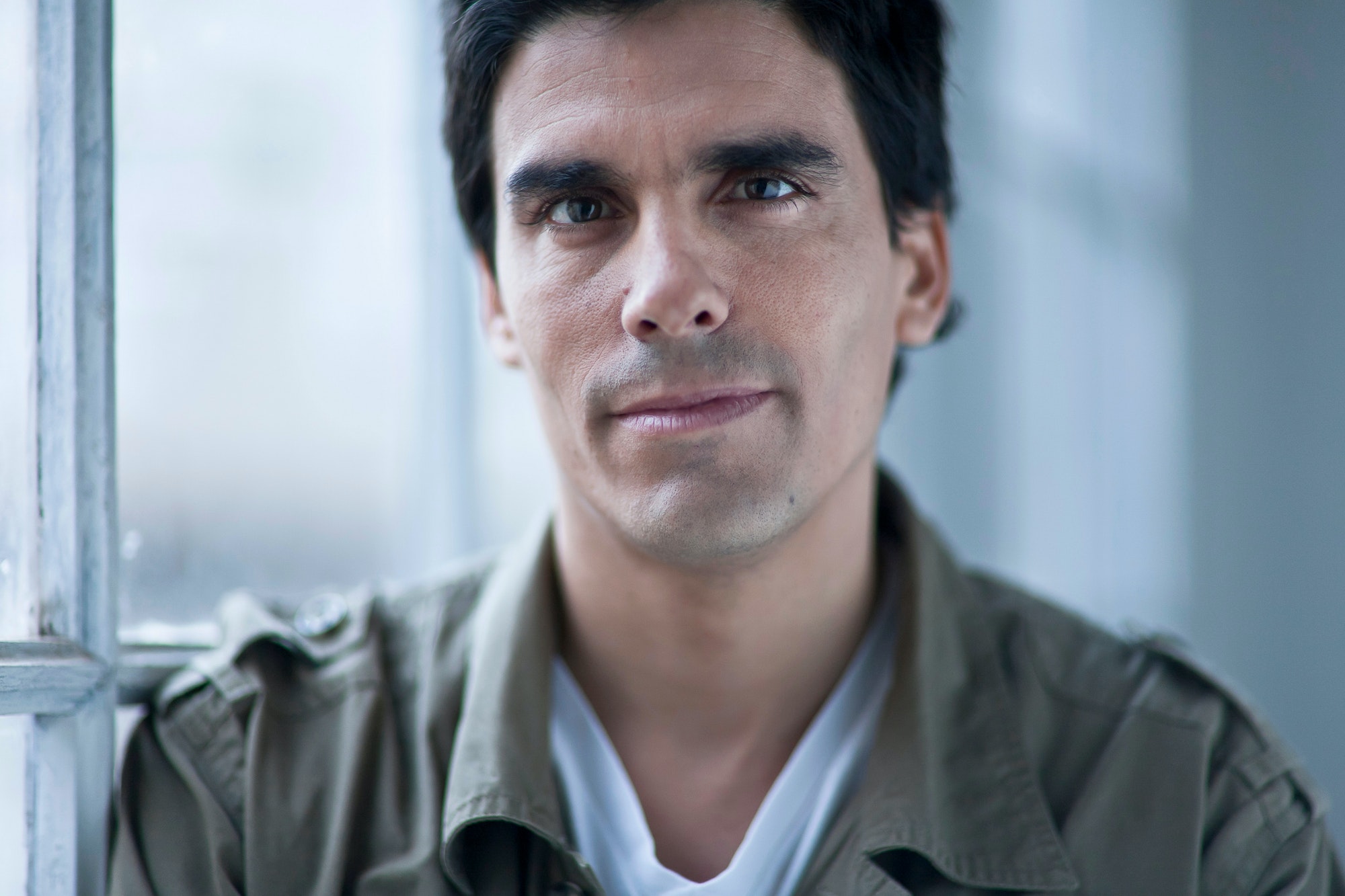 portrait of a man by a window